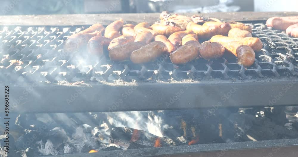 Sticker Charcoal flame under sausage grilling on an outdoor grill