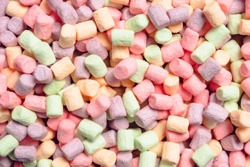 Background with colorful marshmallows. Background and texture. Shot from above.