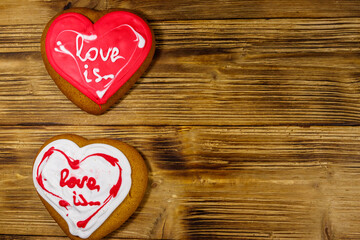 Heart shaped gingerbread cookies on wooden table.  Top view, copy space. Dessert for valentine day