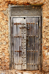 Old decorative wooden door in Stone Town, Zanzibar.