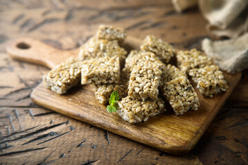 Healthy seeds honey squares on a wooden desk