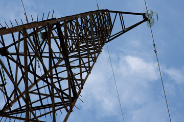 poles of power lines in the field
