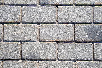 Background  of gray granite tiles in the form of brickwork