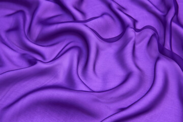Abstract purple color silk chiffon fabric texture. A mockup of silk tissue as background at  the...