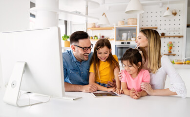 Online school, technology, family concept. Happy parents helping to children to study at home