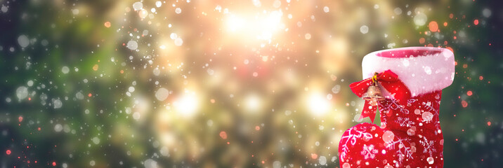 Christmas concept: Christmas shoes on Abstract christmas lights background