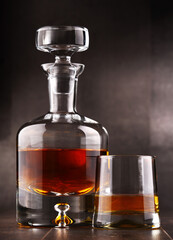 Composition with glass and carafe of hard liquor