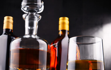 Carafe and bottles of assorted alcoholic beverages.