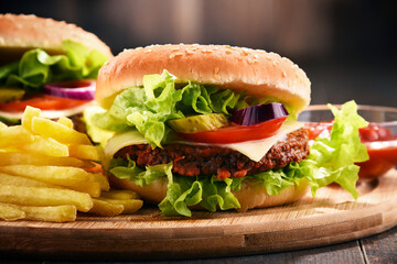 Homemade hamburger with cheese and fresh vegetables