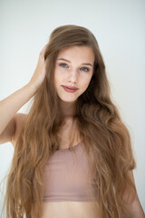 Naklejka premium Portrait of a beautiful young woman with clean skin, beauty treatment, cosmetology and anti-aging theme