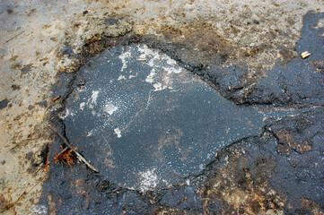 Spills of crude oil on the soil surface - environment pollution.