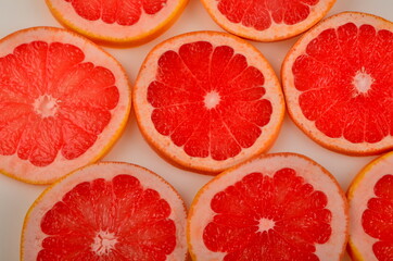 Slices Red grapefruit background, Citrus fruit background