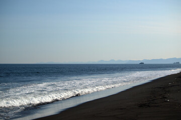 Fototapeta na wymiar Kamchatka. Khalaktyrsky beach. Black volcanic sand beach on the Pacific Ocean. Archive photo, 2008