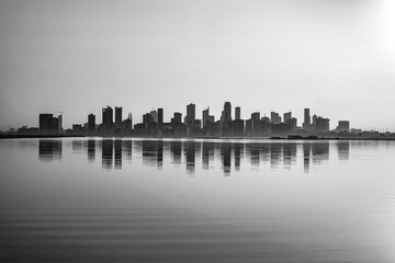 Reflection of the city skyline in Nurana island Bahrain