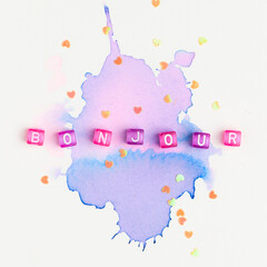 BONJOUR beads word typography on purple watercolor © Rawpixel.com
