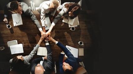 Obraz na płótnie Canvas Business people joining hands as a team