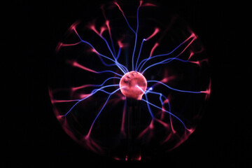 High-voltage arc at coil of Tesla. Plasma lamp. Abstract concept of electric power