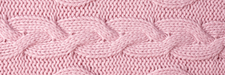 Knitted wool background. Pink texture knitted wool sweater