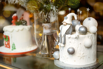 Decorated white christmas cake with winter scene