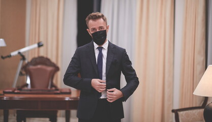 business man wearing protective face mask at office