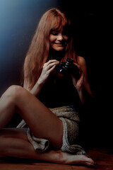 ginger woman with camera