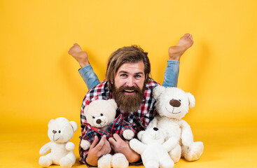 happy handsome bearded guy with unshaven face and stylish hairdo wear casual clothes and playing...