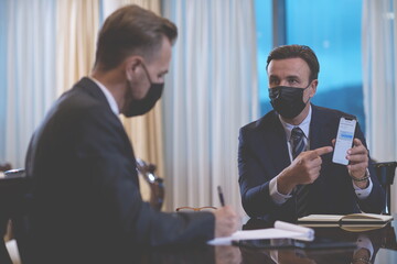 business people wearing crona virus protection face mask on meeting