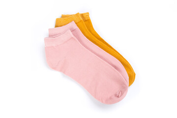 two pairs of colored short socks on a white background, top view