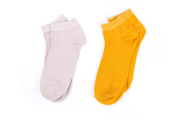 two pairs of colored short socks on a white background, top view