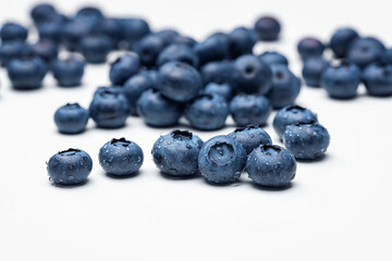 Fototapeta na wymiar Blueberry fruit closeup with dew drops background. 