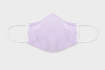 Pastel purple fabric face mask on a gray background