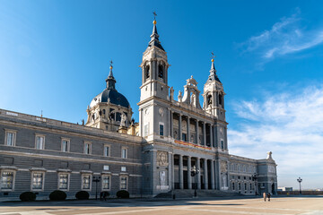 Fototapeta na wymiar Beautiful view of Cathedral of La Almudena in Madrid on bright blue sky