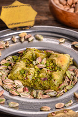 World famous baklava making in Gaziantep. Baklava presentation on wooden board. 