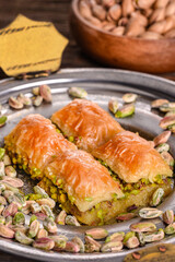 World famous baklava making in Gaziantep. Baklava presentation on wooden board. 