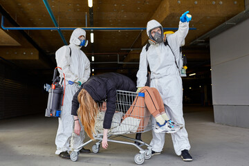 disinfectants found infected people, take them out of the zone, women lie on truck during epidemic, outdoors
