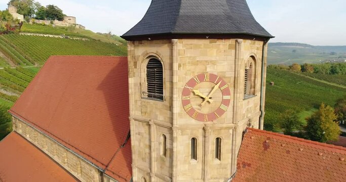 Circling around the old historic Johanneskirche in beautiful sunny Weinberg town in Germany. Heilbronn district. Footage 4k.