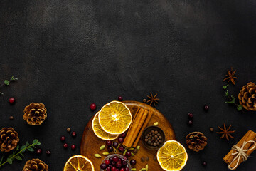 Various spices for preparing mulled wine hot drink. Cinnamon, honey, spices and cranberries