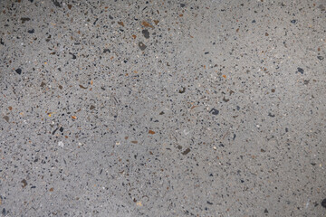 Ground Concrete floor inside building with polished gravels.