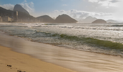 Ocean surf on the beach of Copacabana. Rio de Janeiro, February 2020