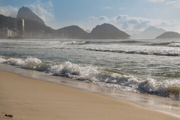 Ocean surf on the beach of Copacabana. Rio de Janeiro, February 2020