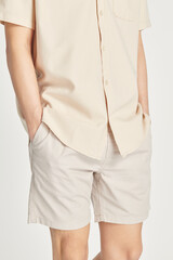 Man wearing a minimal beige shirt mockup