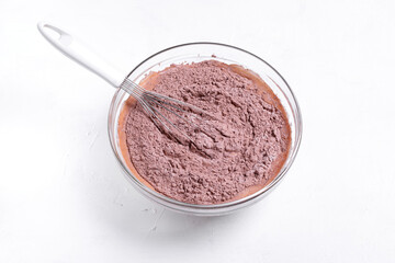 Liquid and dry ingredients mixed with wire whisk in the bowl. Step 6 to make chocolate cookies