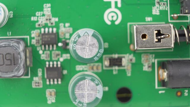 Macro picture of green circuit board with different components