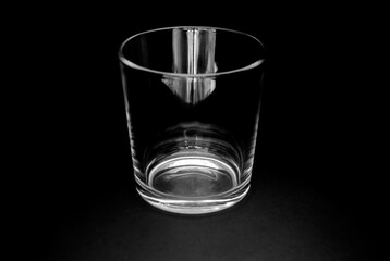 Transparent empty glass on dark background