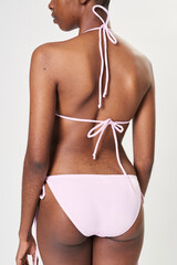Black woman in light pink two pieces bikini mockup