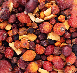 Heap of dried fruits on a white