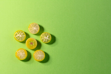 colored candies on a green background