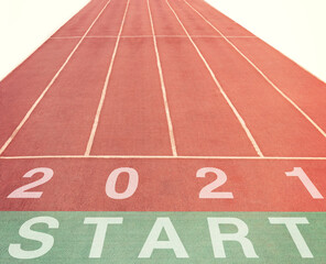Start and numbers 2021 on a treadmill. Get started for success in the new year.