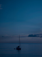 Night lonely boat in the sea