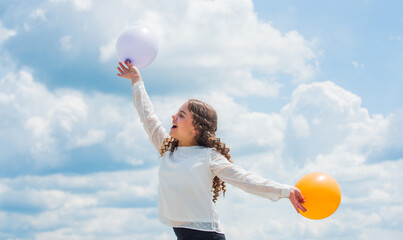 Party time. express positive emotions. just have fun. freedom. summer holidays celebration. international childrens day. Happy child with colorful air balloons over blue sky background
